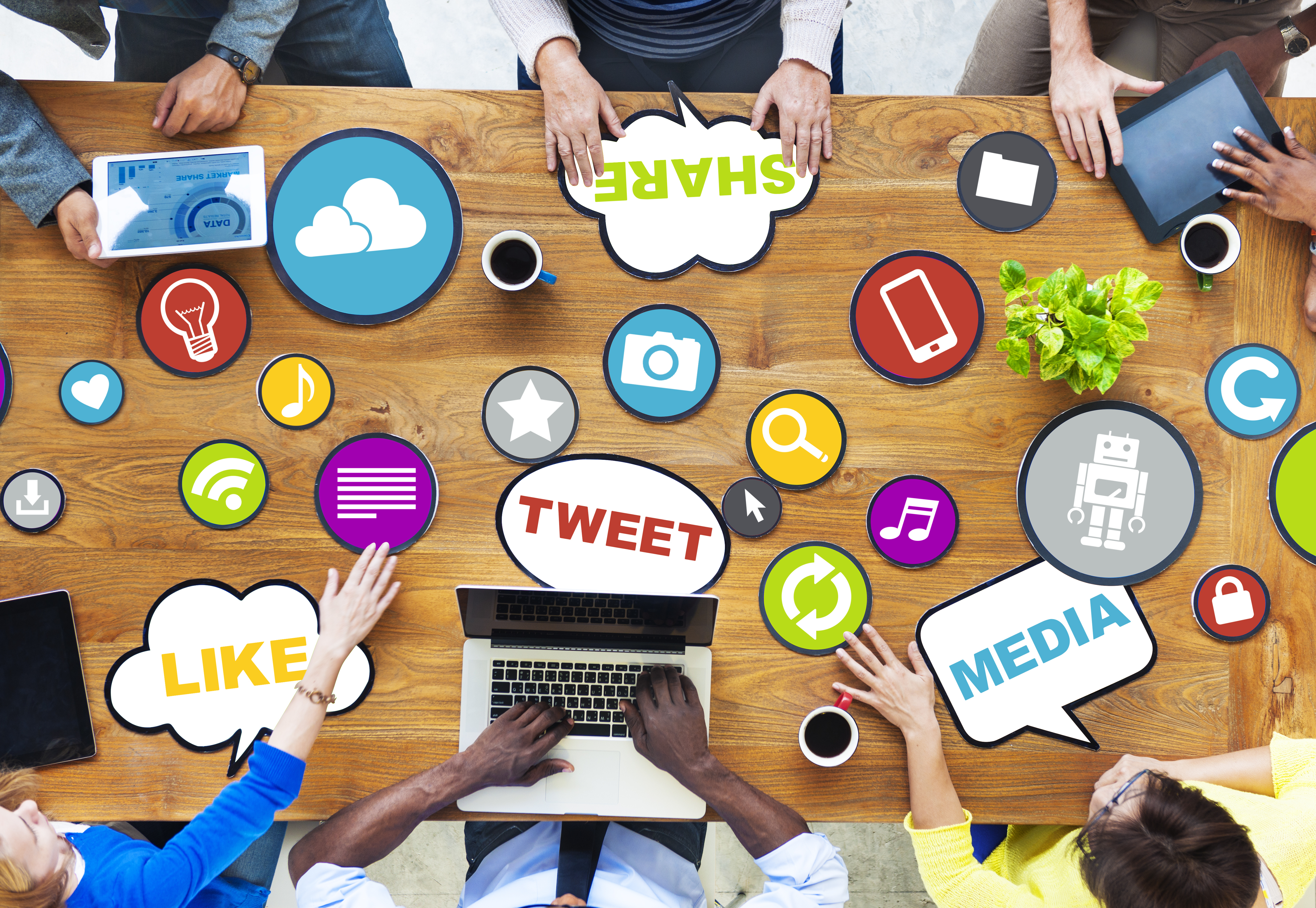 A brown table with small grahics showing all the different types of social media that can be used for marketing.